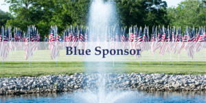 Blue Sponsor Banner overlaid a photos of a field of grass with American Flags waving behind a spouting fountain in a pond